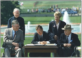photo of President George H W Bush signing the ADA