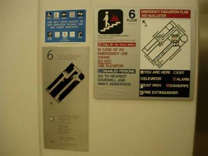Signage next to elevators with directions for emergency evacuation