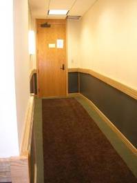 Ramp to judge's bench without handrails or sufficient landing space at the door