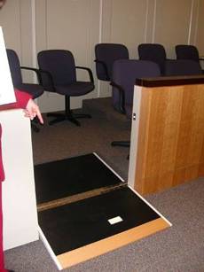 Flip-down ramp to jury box