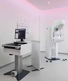 Photograph of Philips MicroDose Mammography System showing both mammography machine and staff station.