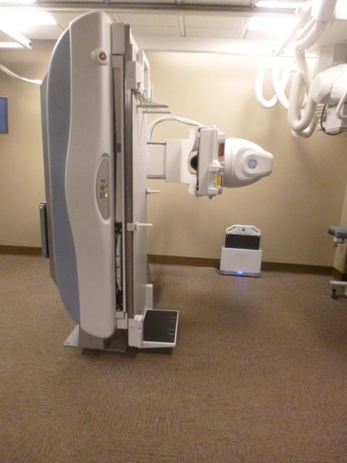 Thie pictures show an Angulating Radiographic and Fluoroscopic Exam Table whose fixed height is approximately 34.5 inches.   The table surface is also able to move in two directions horizontally.  