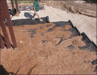 Figure 4--- Completion of drainage system; second layer of fabric laid over drainage rock. 