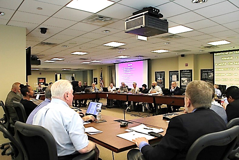 People seated around a board room table
