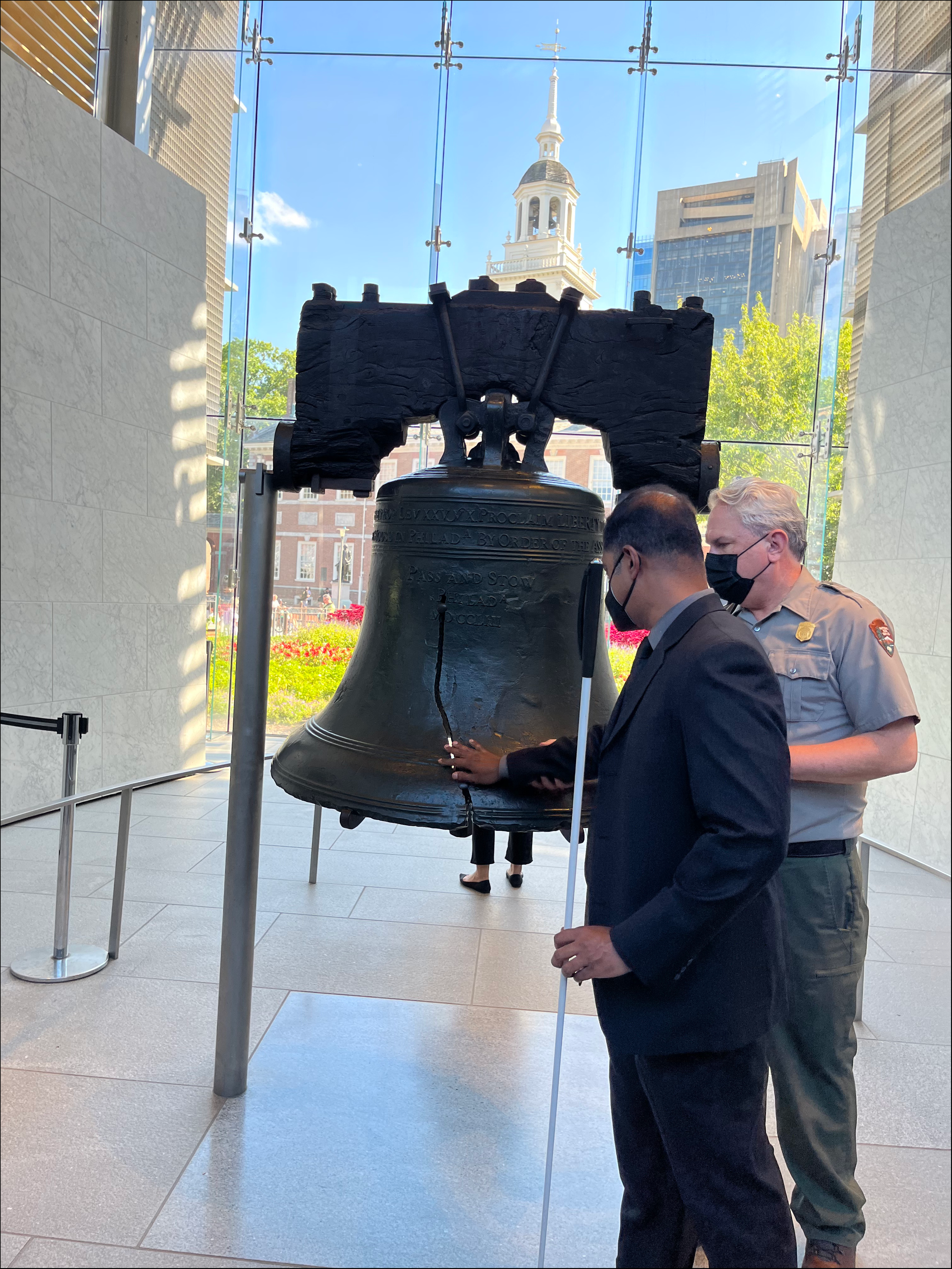 Access Board Executive Director Sachin Pavithran touching the Liberty Bell